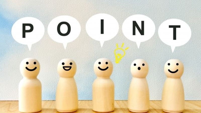 Macのデータ復旧業者を選ぶ際の重要なポイントを解説する、笑顔の木製人形と「POINT」の文字が書かれた吹き出しの図解。