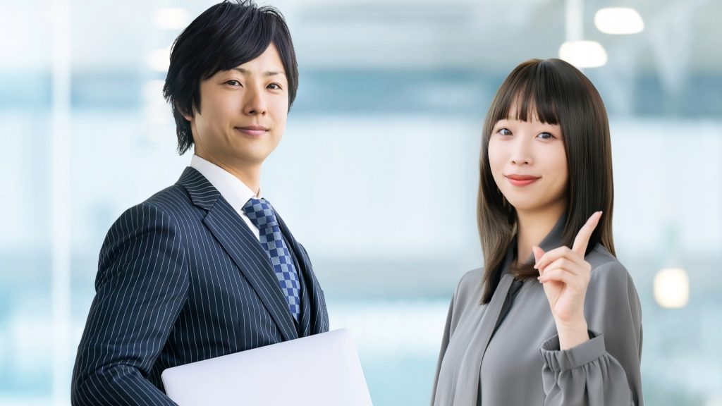 Windows「自動修復を準備しています」トラブル解決後のイメージ。専門家に相談して安心する男女のビジネスパーソン。